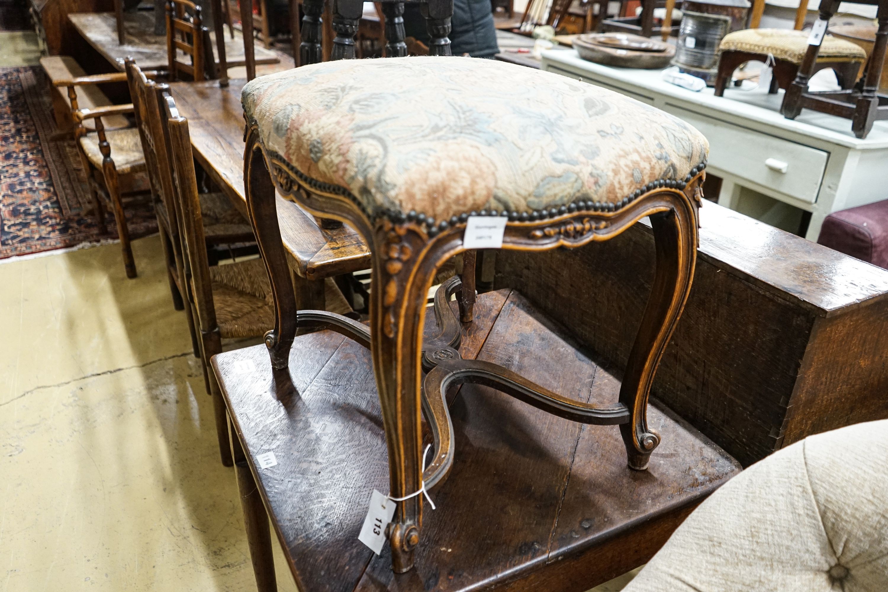 A French stained beech cabriole leg dressing stool with saltire stretcher, width 54cm, depth 41cm, height 51cm